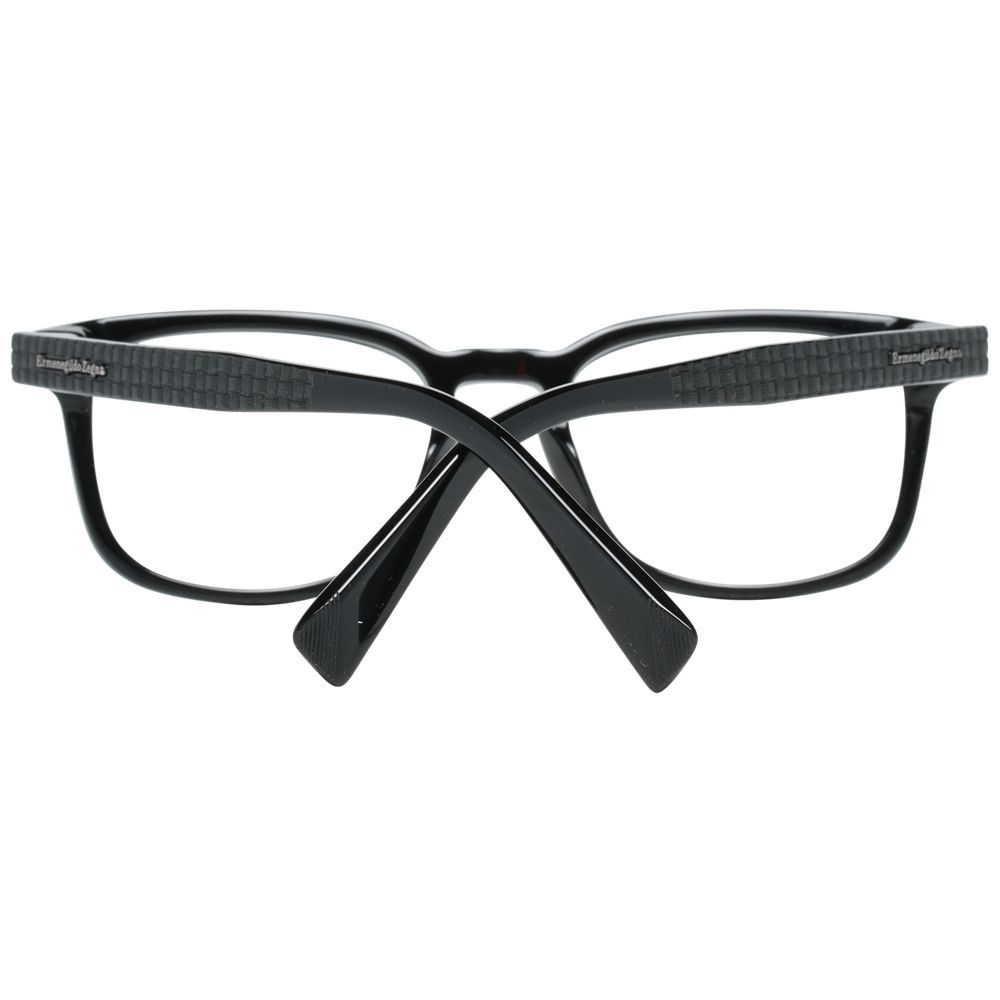 The Ermenegildo Zegna Black Plastic Glasses (Frames) are men's rectangular eyeglasses shown from the back with crossed arms, featuring a subtle textured pattern on the arms for added style.