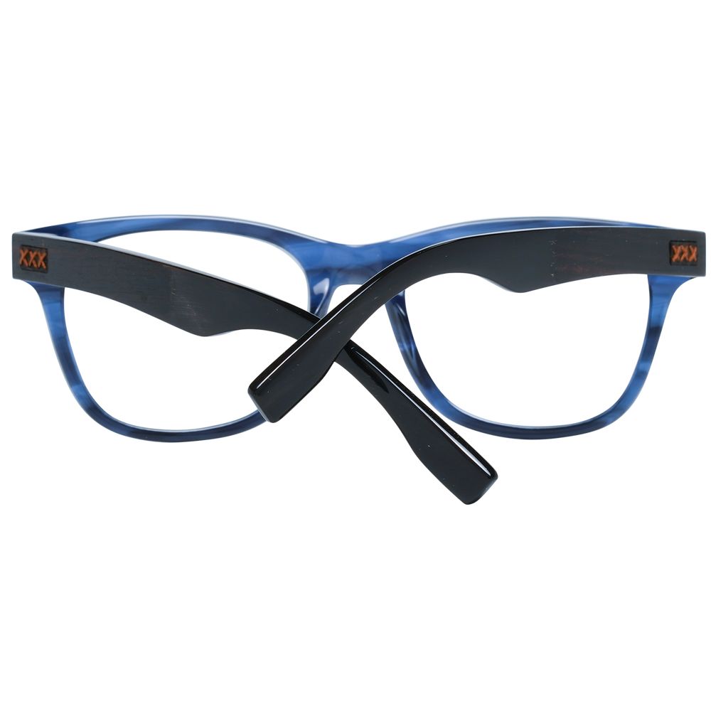 The Ermenegildo Zegna Blue Plastic Glasses feature blue frames for men and black arms crossed in an X shape, visible from the back. Orange “XXX” details near the hinges add a bold accent to these stylish men’s eyeglass frames.