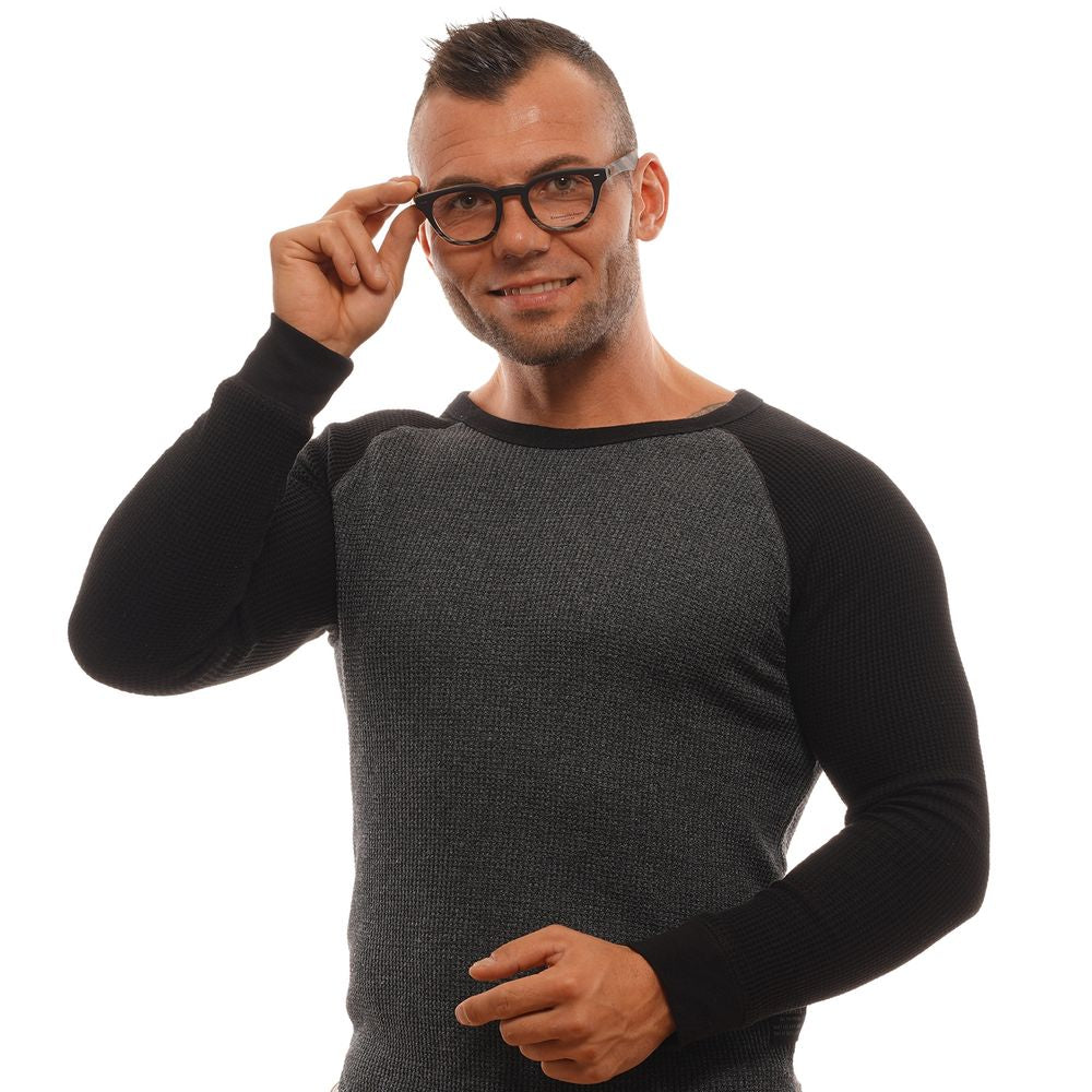 A man smiles while adjusting his Ermenegildo Zegna Black Plastic Glasses (Frames) with one hand, wearing a long-sleeve dark sweater against a white background.