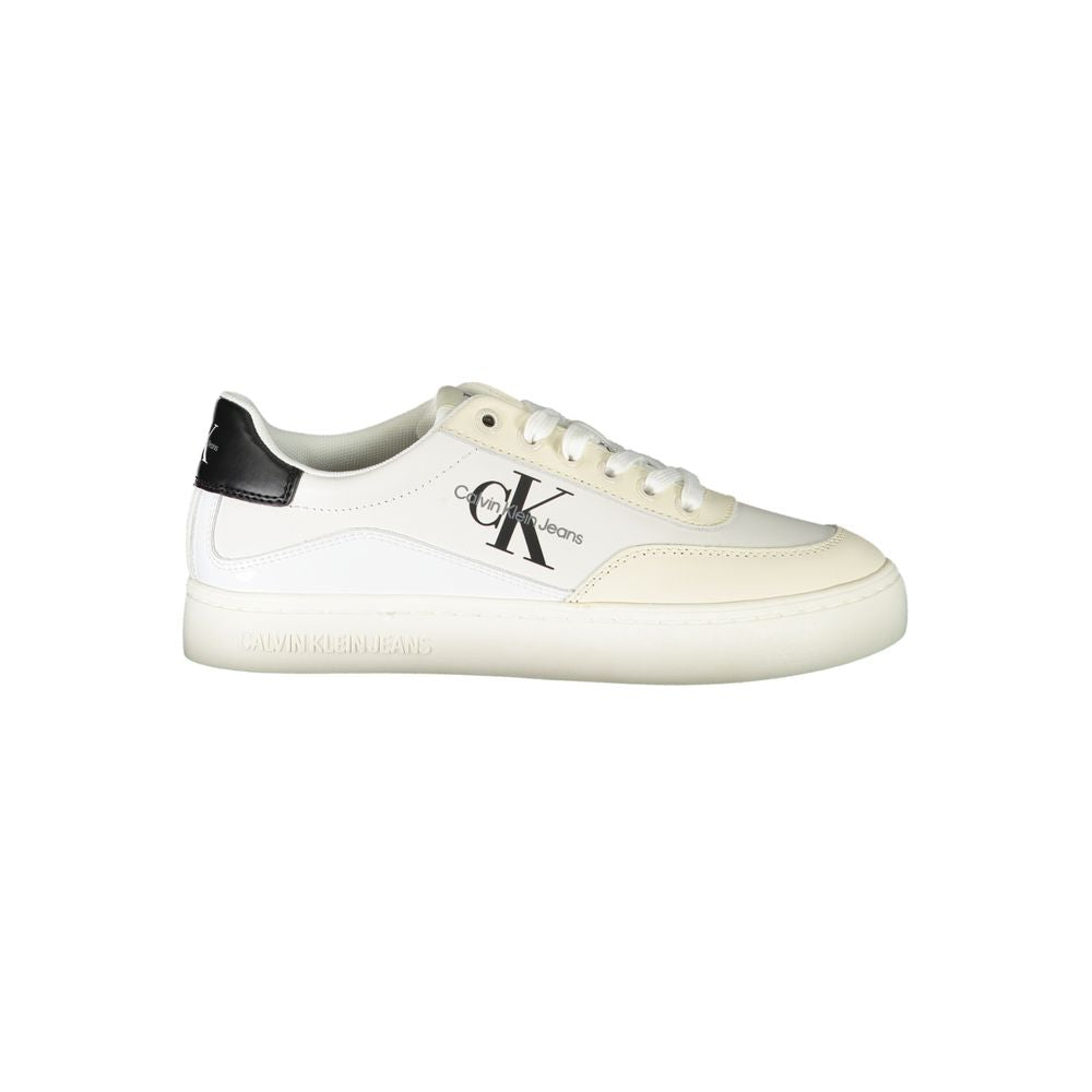 The Calvin Klein White Polyurethane Women Sneaker features a black heel tab, white laces, and a bold CK logo on the side, displayed from a side profile against a plain white background.