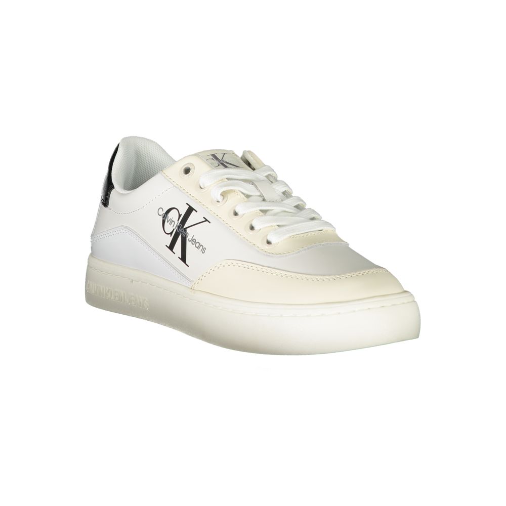 The Calvin Klein White Polyurethane Women Sneaker features a bold black CK logo on the side, white laces, and a clean white sole. Shown against a plain white background.