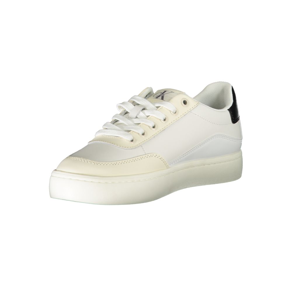The Calvin Klein White Polyurethane Women Sneaker features white laces, a subtly off-white sole, and a black heel accent with the CK logo, shown against a plain white background.