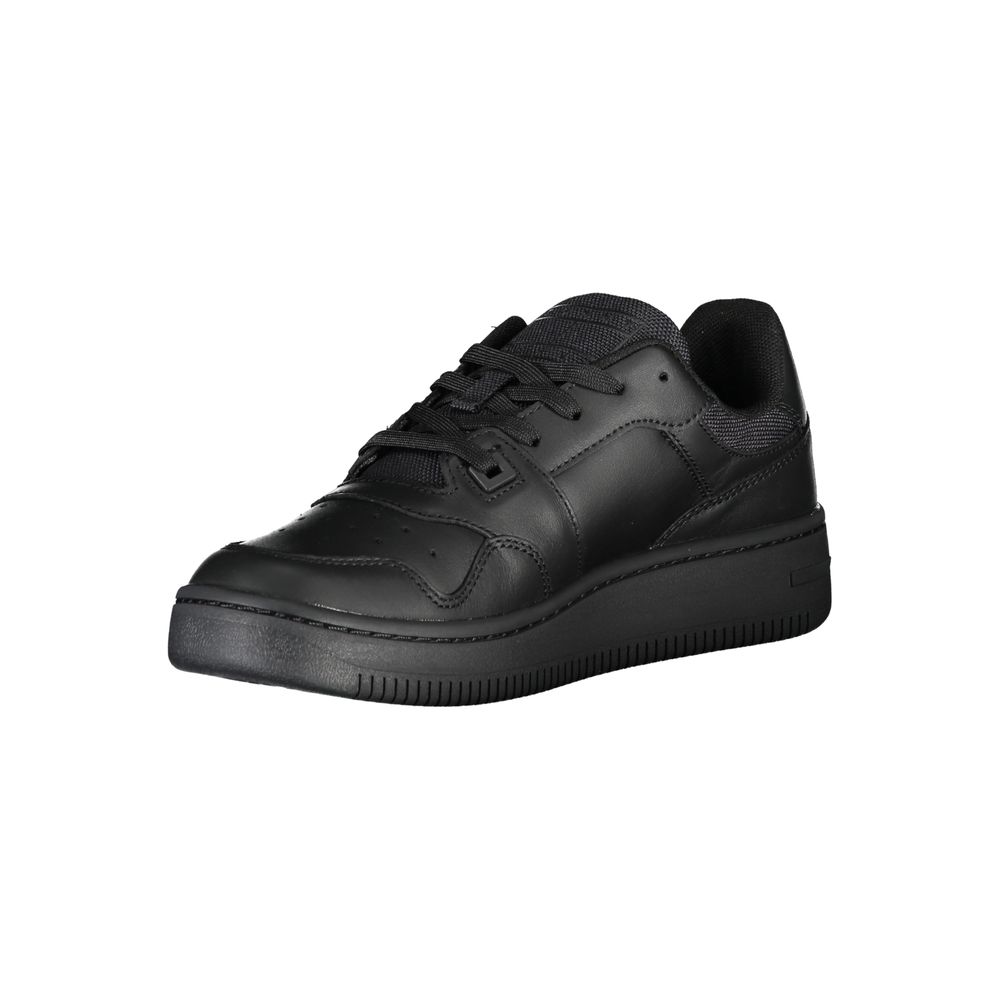 The Tommy Hilfiger Black Leather Women Sneaker, a low-top with a flat sole, lace-up closure, and perforated toe area, showcases casual luxury sports style against a white background.