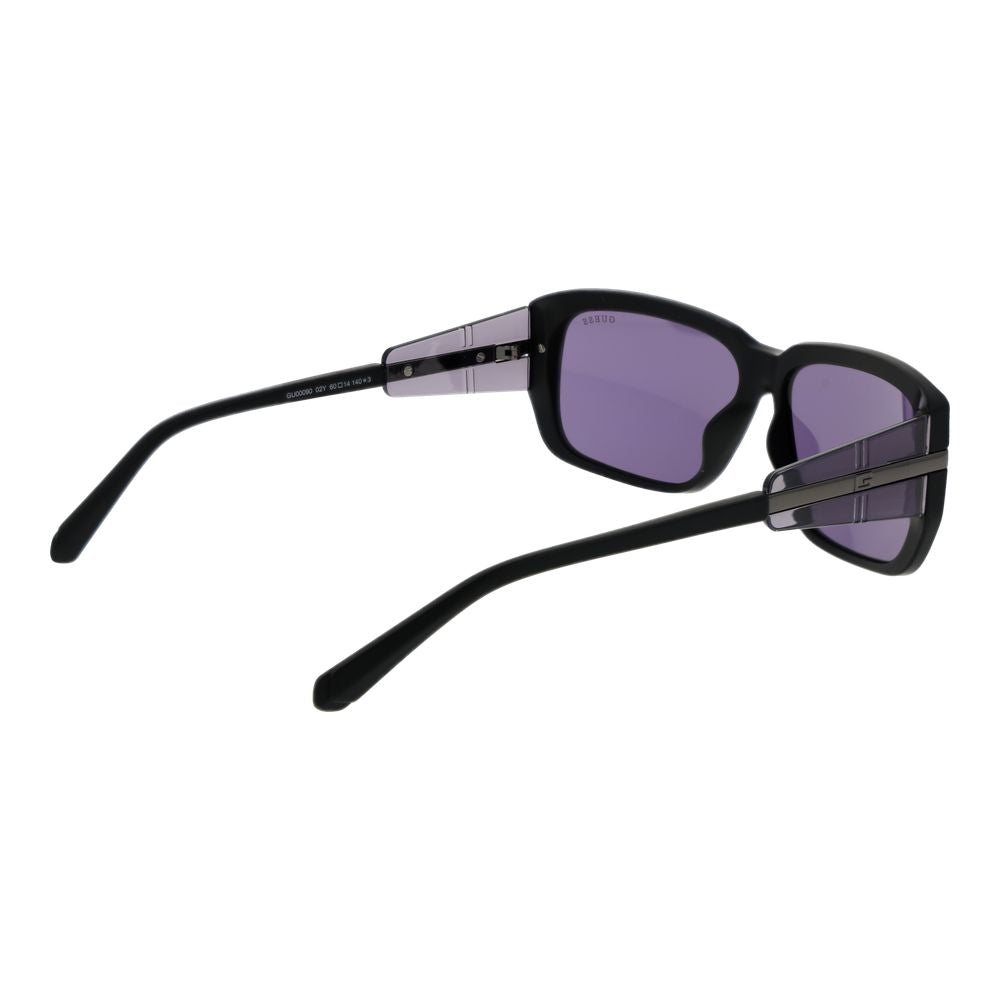 Guess Black Plastic Sunglasses for men feature thick black frames, purple-tinted square UV-protective lenses, and silver horizontal accents on the arms, shown in a three-quarter rear view.